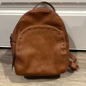 Maurice’s backpack purse.